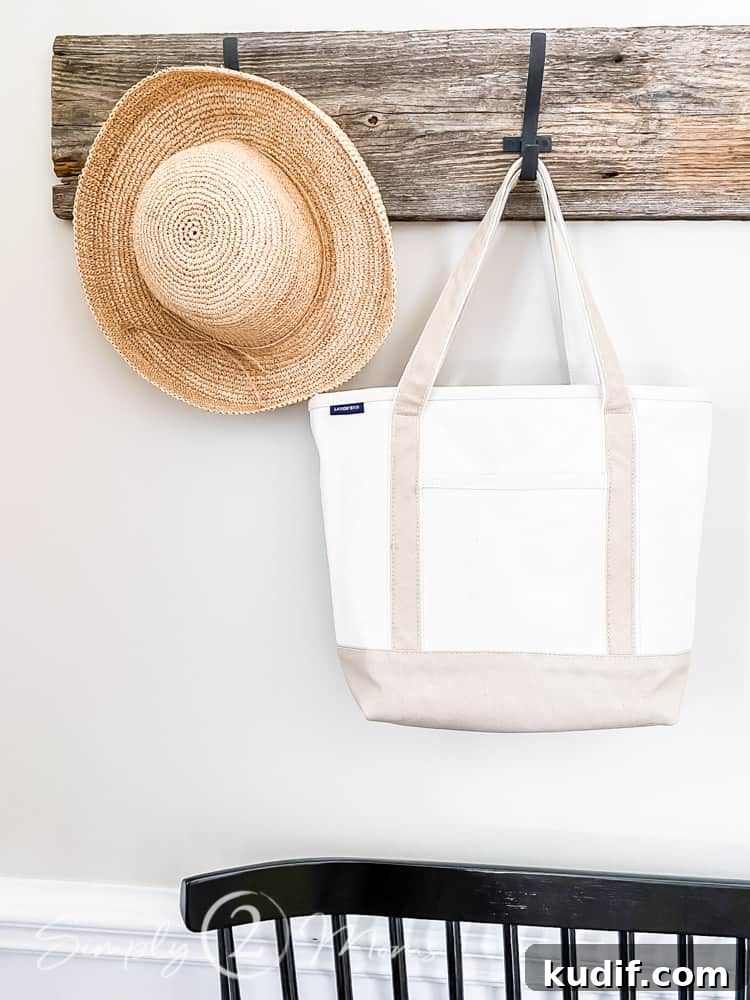 tote back and straw hat hanging on row of hooks