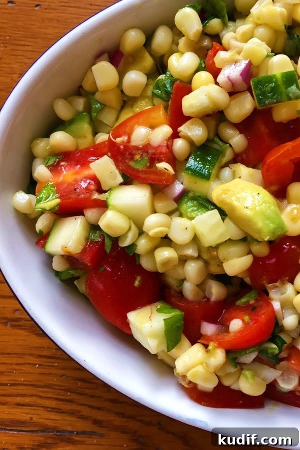 Summer Avocado, Corn, Cucumber & Tomato Salad Recipe 2 summery salad with corn, avocado, tomatoes and cucumbers