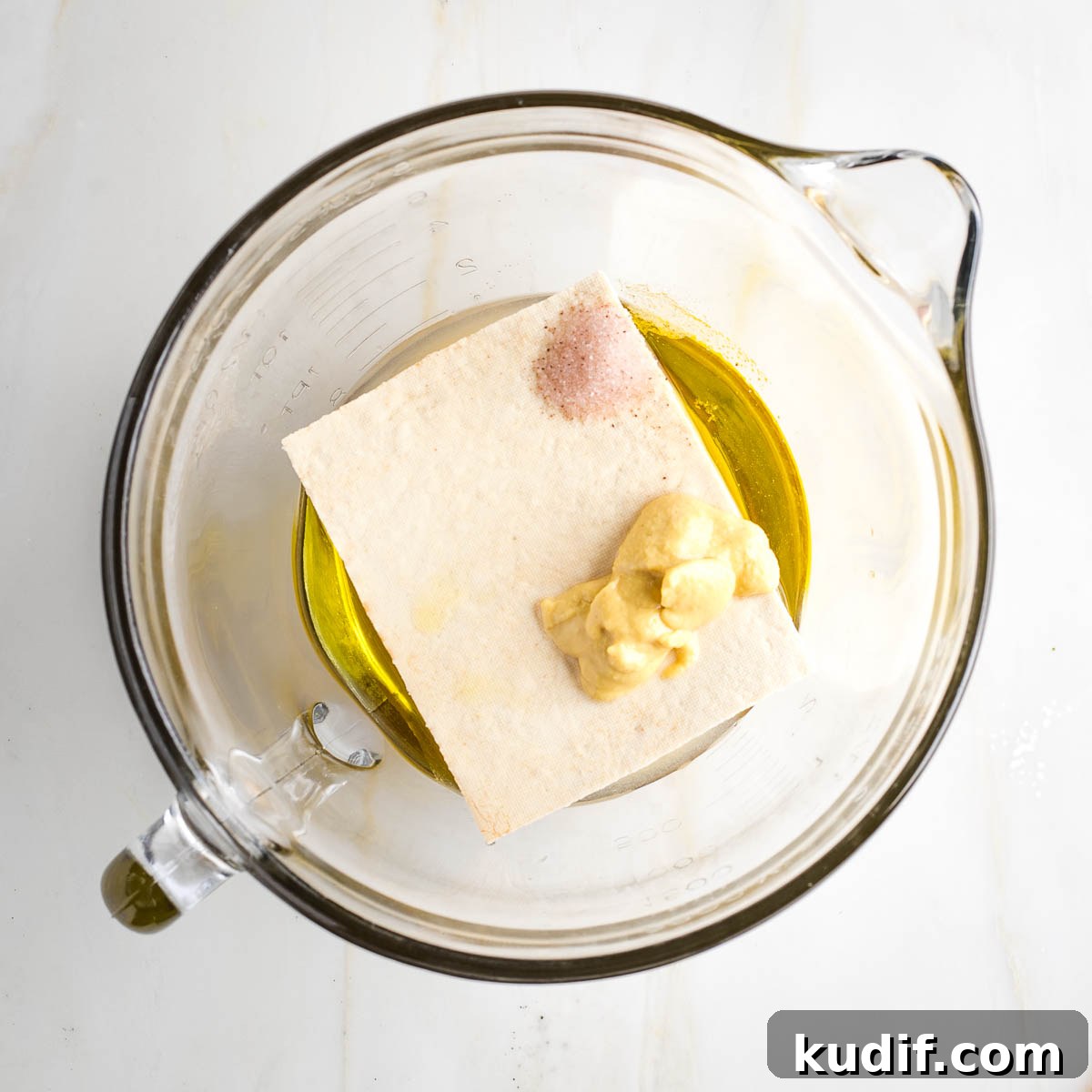 Creamy Tofu Vegan Mayonnaise Recipe — Quick & Luscious 5 Large glass measuring cup with oil, vinegar, tofu, mustard and salt.