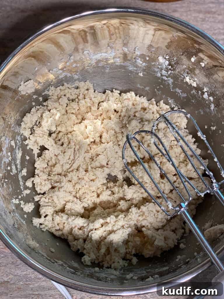 Raspberry Jam Thumbprint Cookies Recipe for Soft, Buttery Cookies 10 process shot of mixing ingredients in bowl