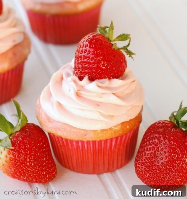 Strawberry Lemonade Cupcakes frosted strawberry cupcake with strawberries