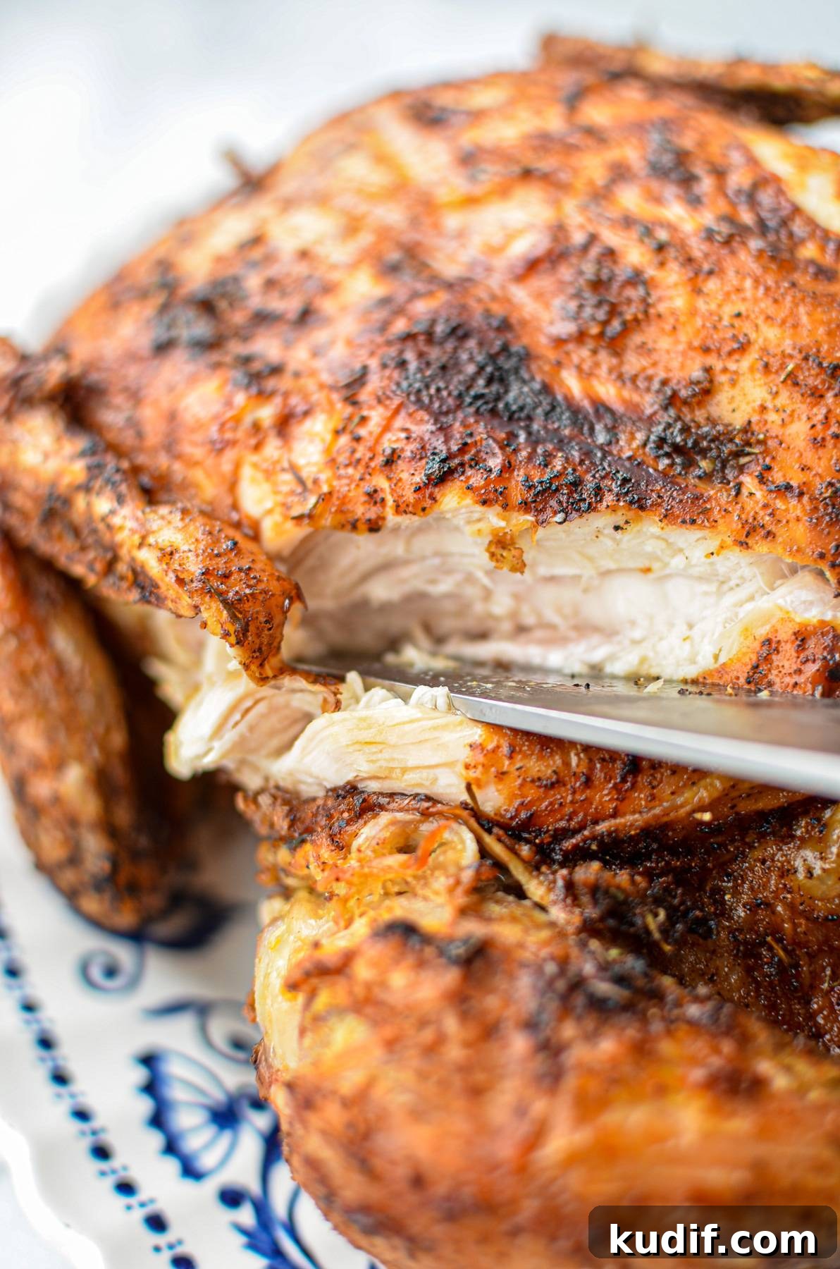 Rotisserie-Style Whole Chicken in the Air Fryer 10 A whole chicken, cut into to show the meat.