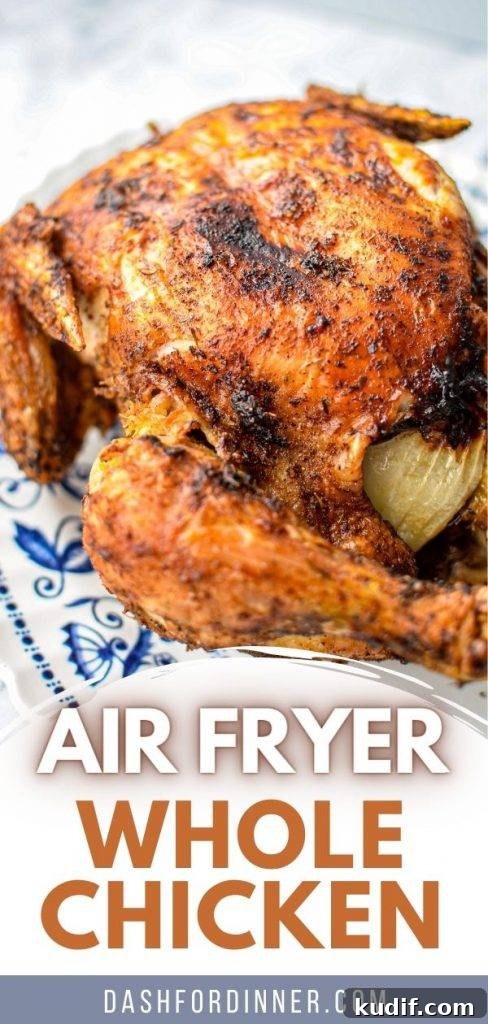 Rotisserie-Style Whole Chicken in the Air Fryer 12 A roasted chicken on a blue scroll plate.