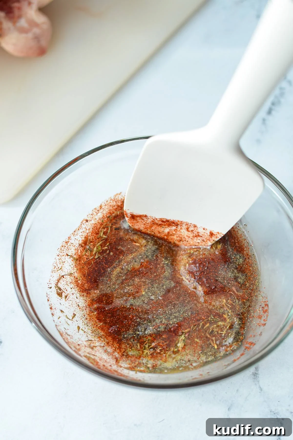 Rotisserie-Style Whole Chicken in the Air Fryer 5 A small bowl of seasonings, blended with oil.