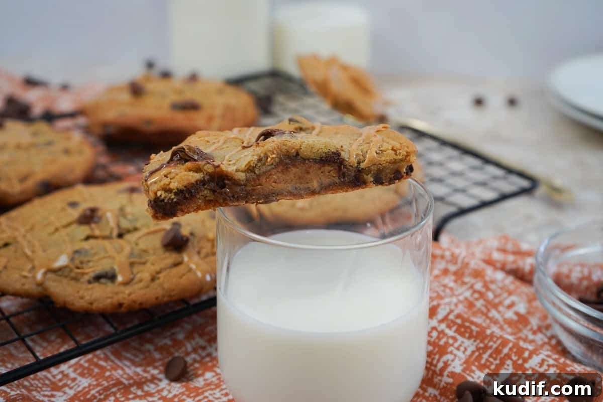 Peanut Butter Cup Stuffed Cookies Recipe for Decadent Treats 6 Reeses Stuffed Cookies with milk