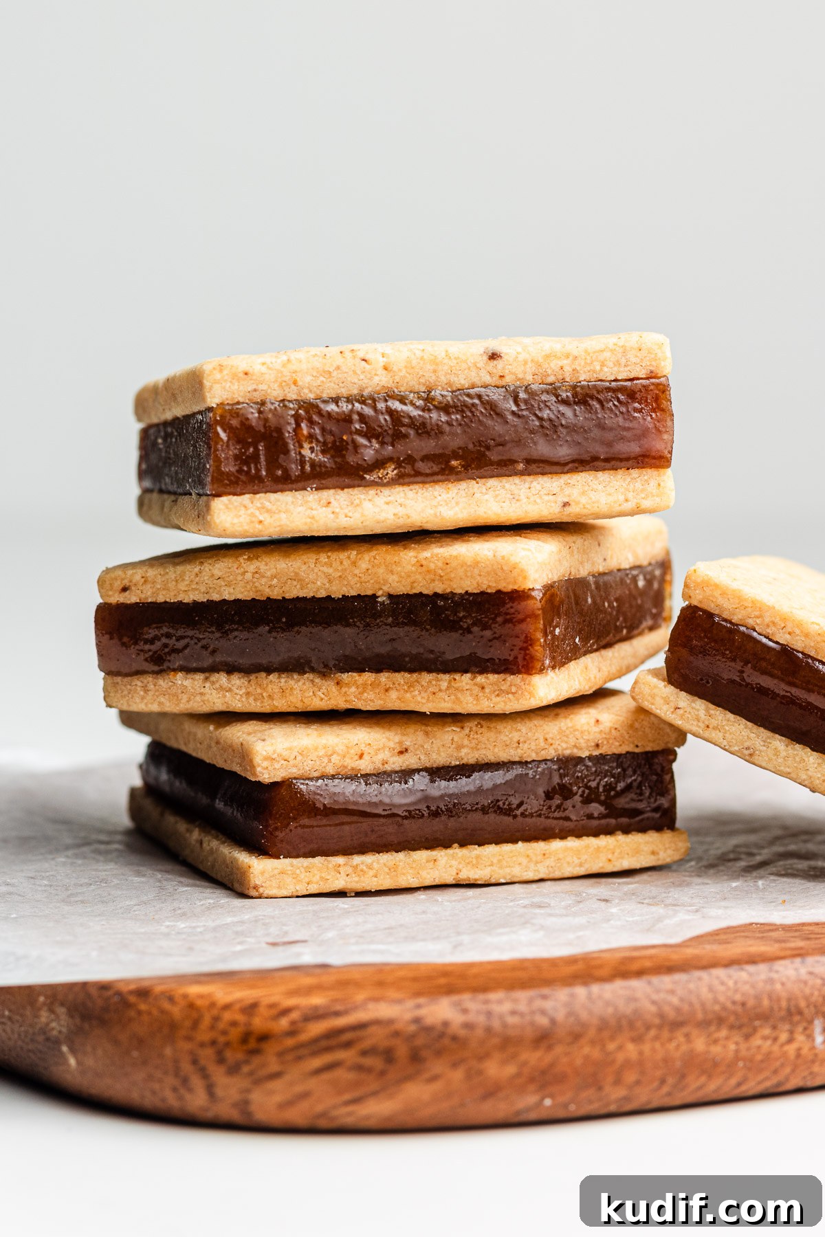 Salted Caramel Sandwich Cookies Recipe — Chewy, Gooey Treat 2 soy caramel sandwich cookies stacked on parchment paper