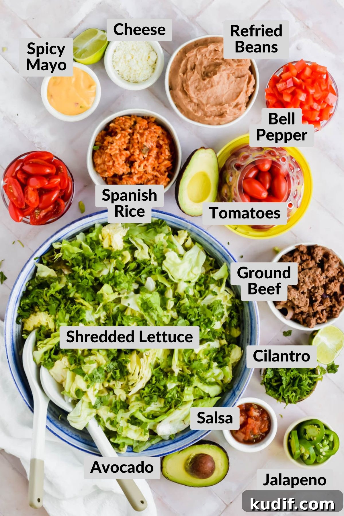 ingredients for Mexican 7 layer salad in individual bowls on white background.