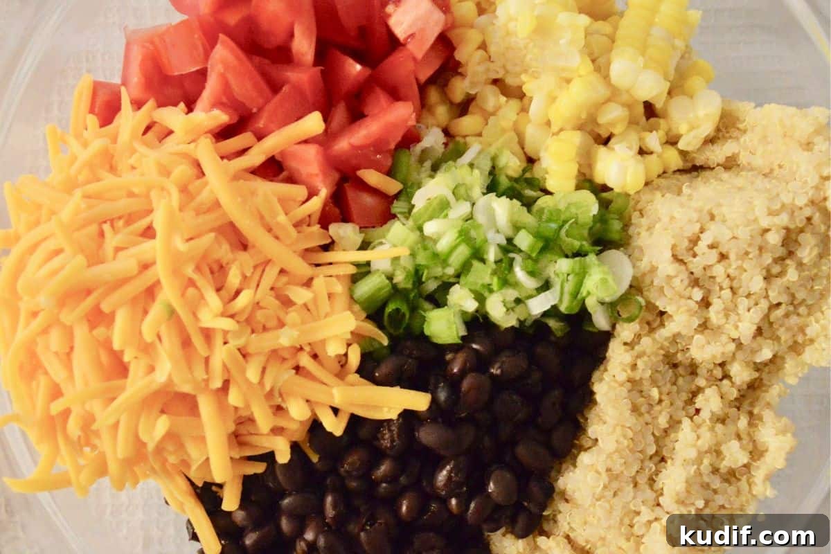 Mexican-Style Quinoa Salad with Corn, Black Beans & Lime Dressing 4 Ingredients for recipe in a large glass bowl.