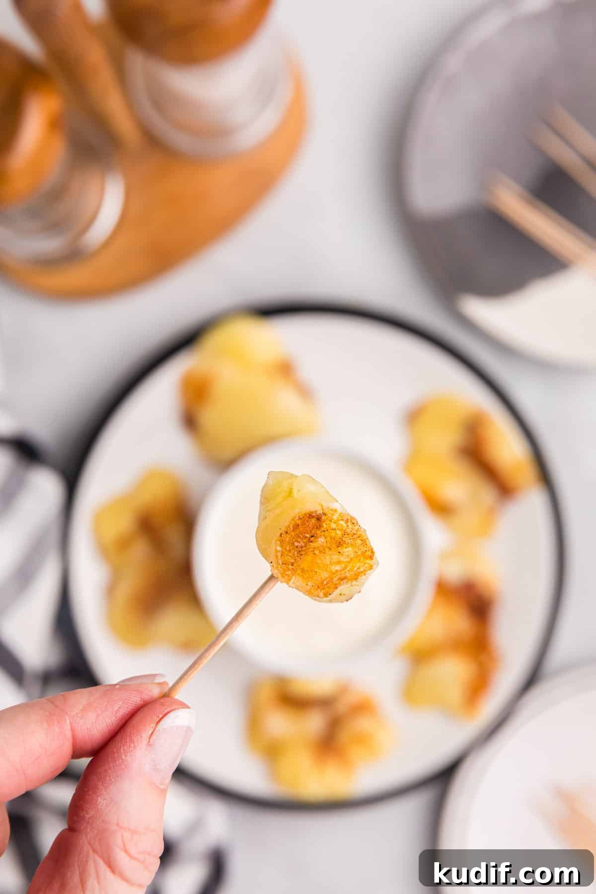 Crispy Blackstone Cheese Curds Recipe for Crowd-Pleasing Snack 2 Blackstone Cheese Curds arranged on plate with toothpicks and dipping sauce