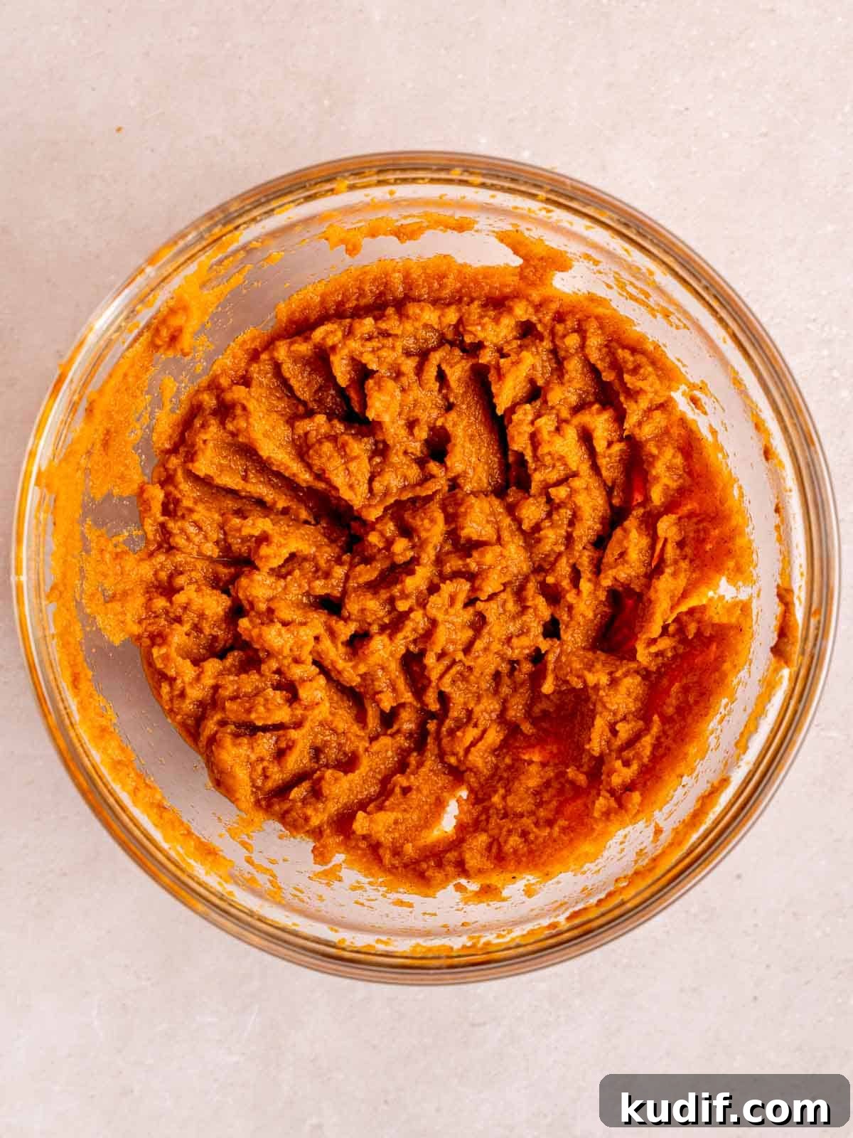 Pumpkin Cheesecake Bars Recipe for Fall Dessert Lovers 6 Pumpkin puree and pumpkin pie spice mixed together in a bowl.