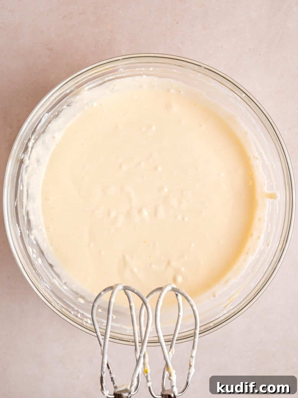 Pumpkin Cheesecake Bars Recipe for Fall Dessert Lovers 7 Cheesecake filling mixed in a bowl.