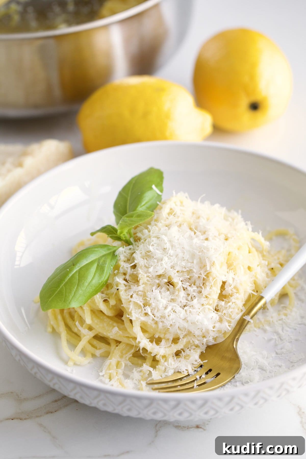 Creamy Lemon Butter Pasta Recipe (Pasta al Limone) 10 Lemon Butter Pasta Sauce (Pasta al Limone) in a serving bowl with basil on the side.