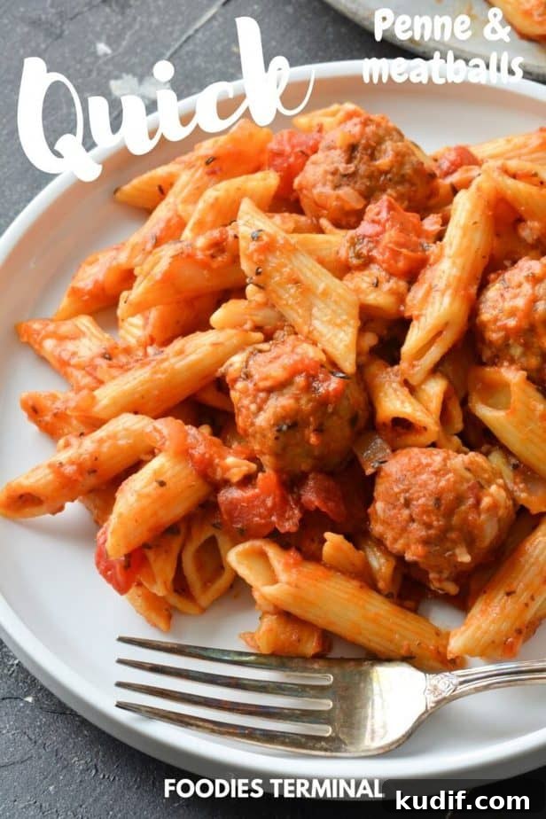 instant pot frozen meatballs and penne pasta served in a white plate with fork