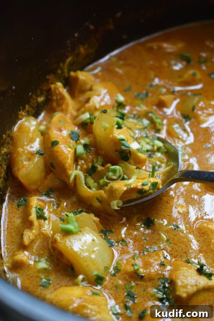 bowl of curry with herbs