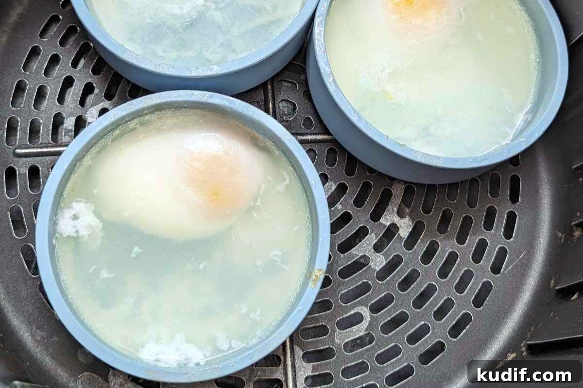 Irresistible Egg Recipes You’ll Make Again and Again 11 Poached eggs in silicome cups in air fryer basket