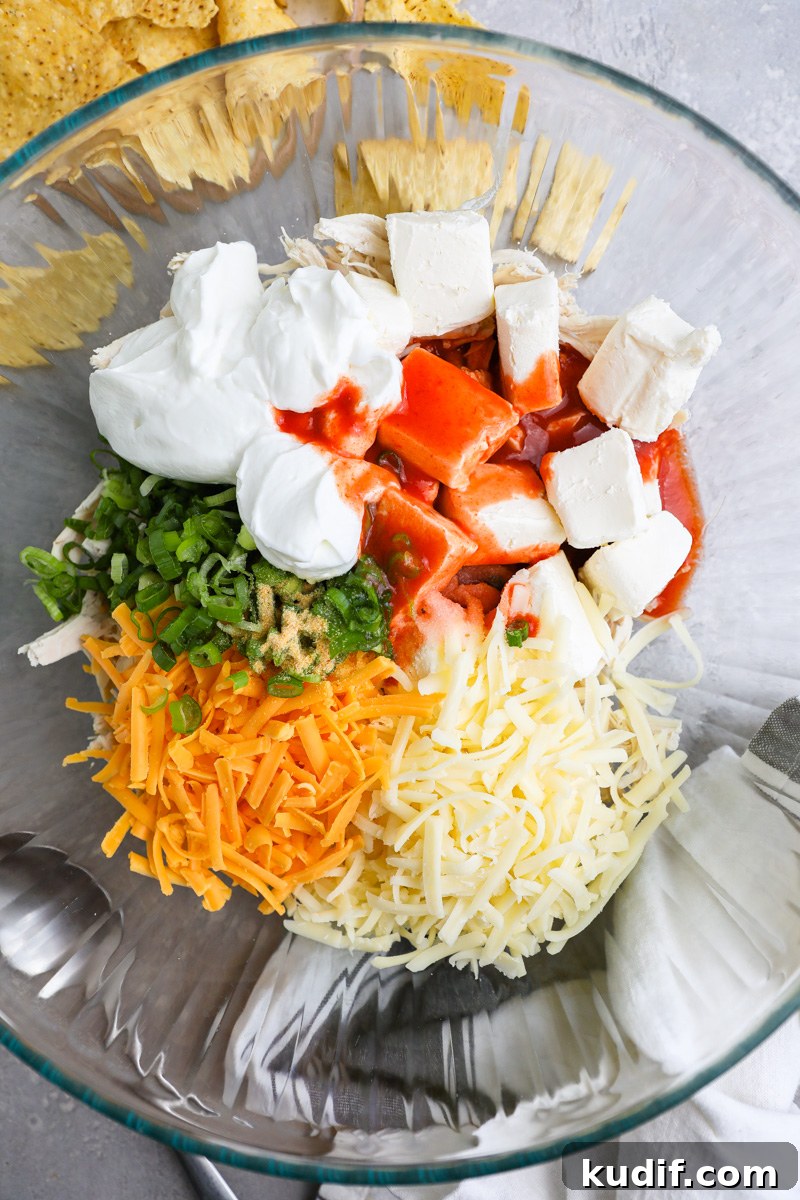 Lightened-Up Buffalo Chicken Dip Recipe for Game Day 4 A large mixing bowl filled with ingredients used to make a lightened up buffalo chicken dip