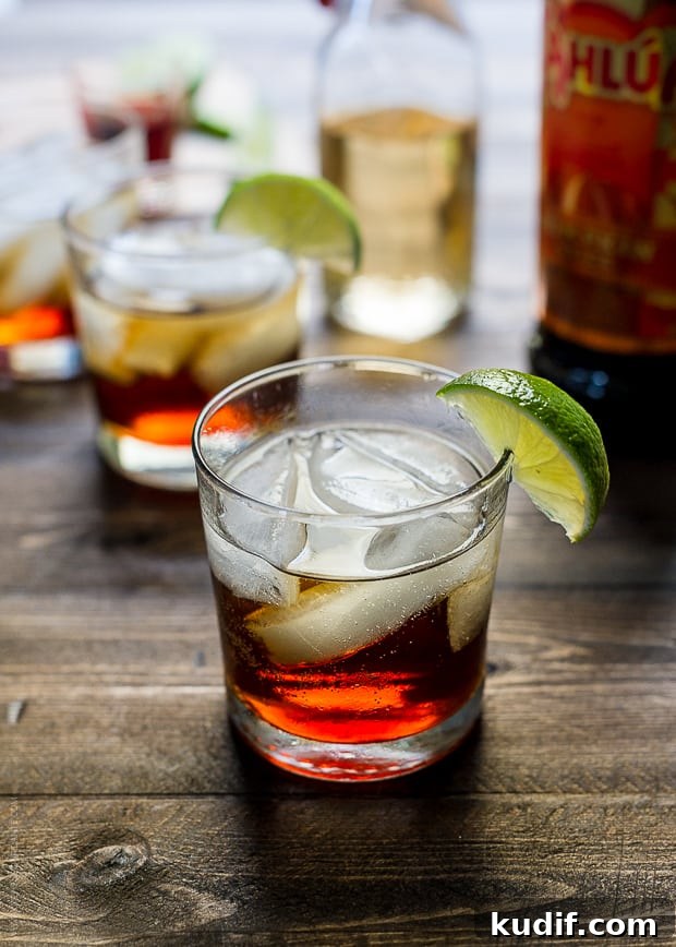 Pumpkin Spice Dark & Stormy Cocktail Recipe for Fall Nights 4 Pumpkin Spice Dark and Stormy Cocktail in a glass with a slice of lime on the rim.