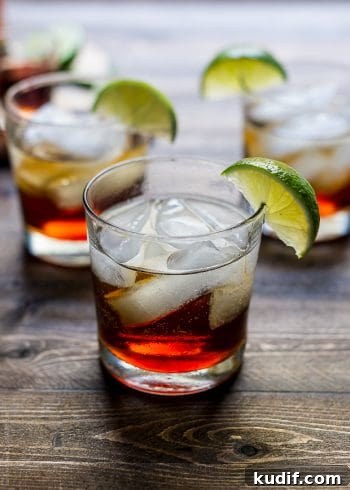 Pumpkin Spice Dark & Stormy Cocktail Recipe for Fall Nights 7 A Pumpkin Spice Dark and Stormy Cocktail on a wooden surface.