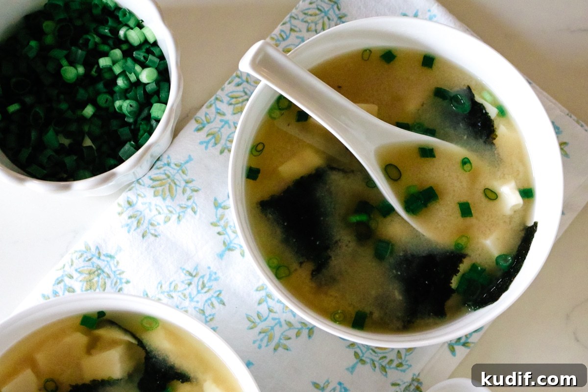 Authentic Homemade Miso Soup: Simple Traditional Recipe 2 Warm miso soup with seaweed and tofu served in a simple ceramic bowl.