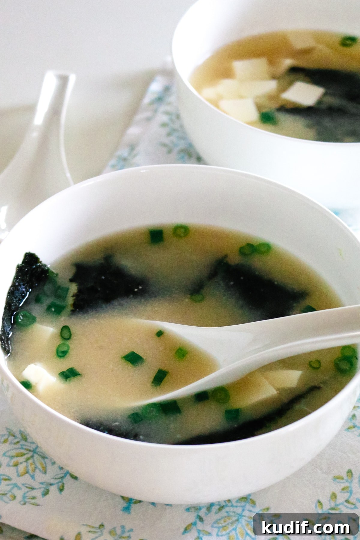 Authentic Homemade Miso Soup: Simple Traditional Recipe 6 Warm miso soup with seaweed and tofu served in a simple ceramic bowl.