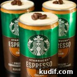Three Starbucks Espresso and cream cans, each with the top taken off so that you can see a cold foam that's topped with three espresso beans.