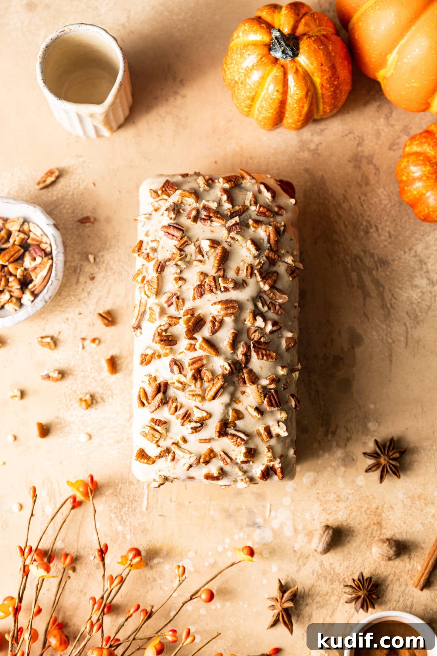 Maple-Glazed Pumpkin Bread Recipe for Fall Baking 3 Maple Glazed Pumpkin Bread with chopped pecans from above
