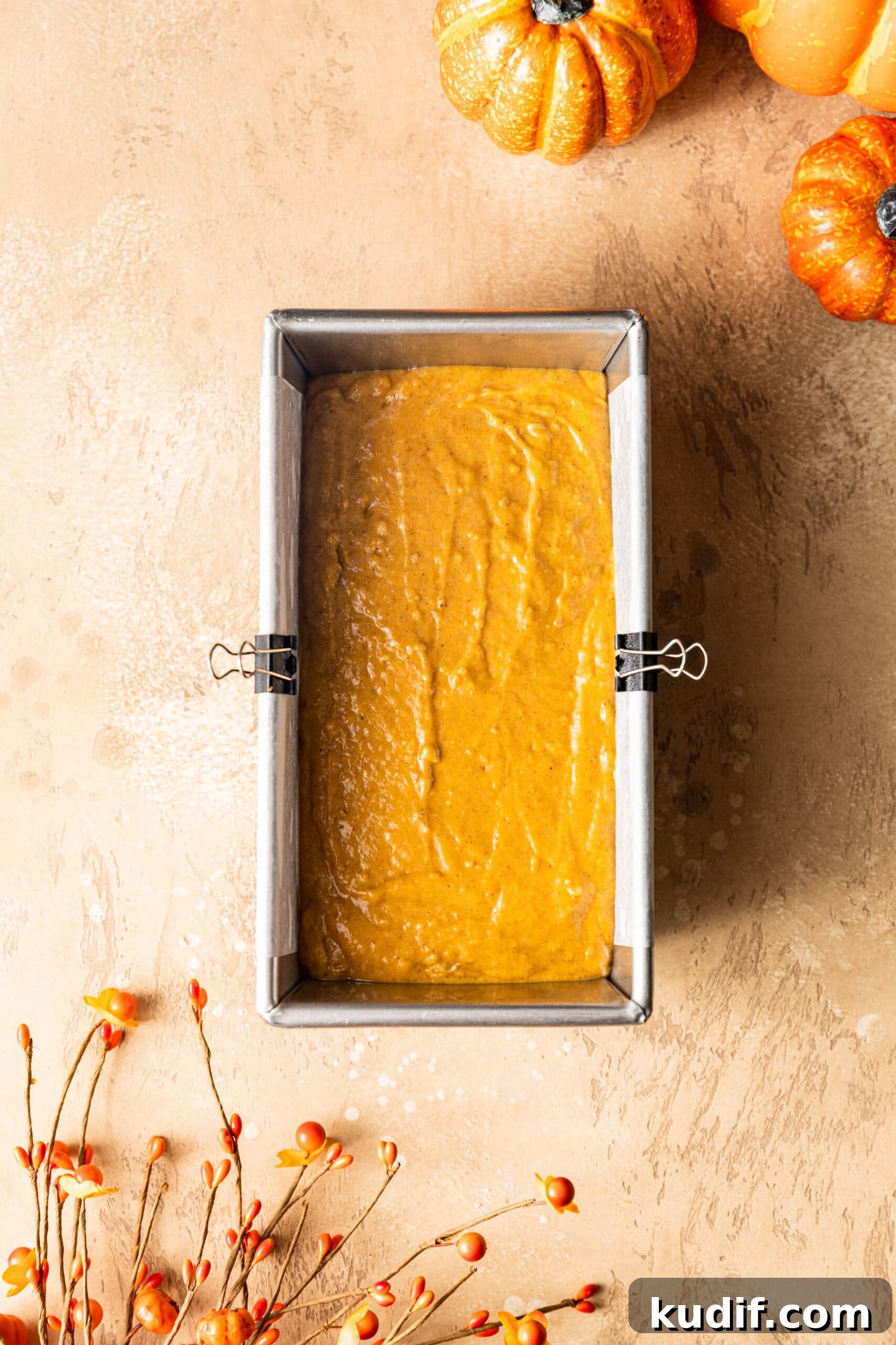 Maple-Glazed Pumpkin Bread Recipe for Fall Baking 7 Pumpkin bread batter inside loaf pan