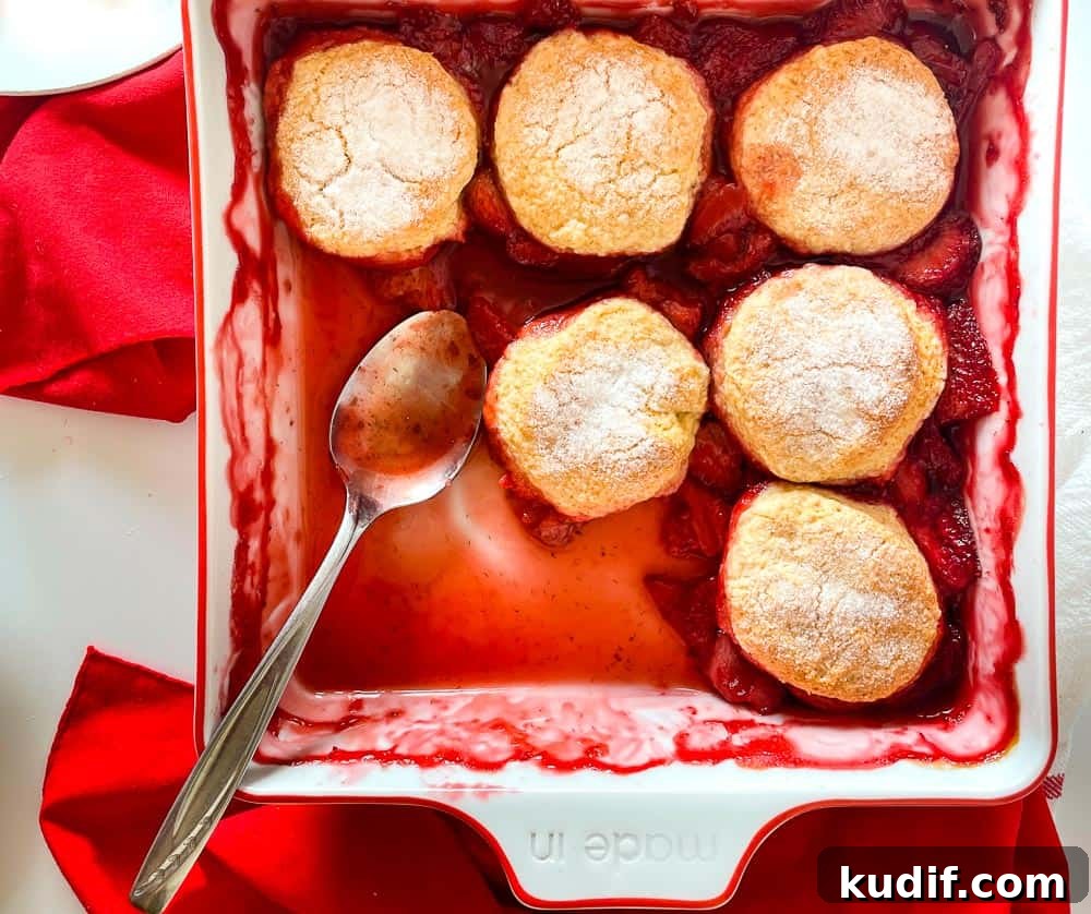 Quick Berry Desserts to Satisfy Sweet Cravings Fast 2 A shot of cobbler with a spoonful taked out of it.