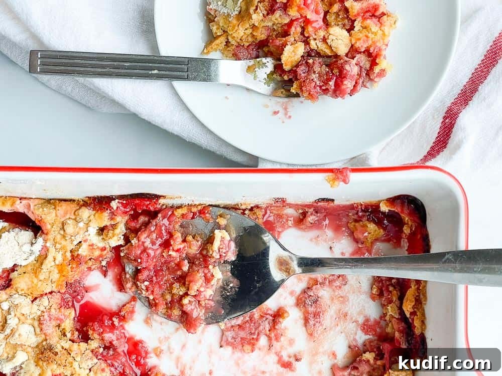 Quick Berry Desserts to Satisfy Sweet Cravings Fast 11 A pan with a scoops of cake dessert taked out.