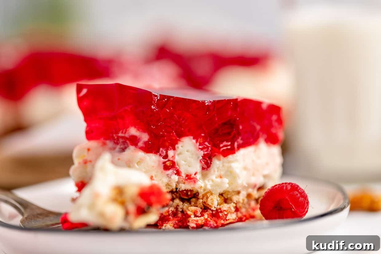 Quick Berry Desserts to Satisfy Sweet Cravings Fast 13 Triple layer pretzel salad with raspberries.