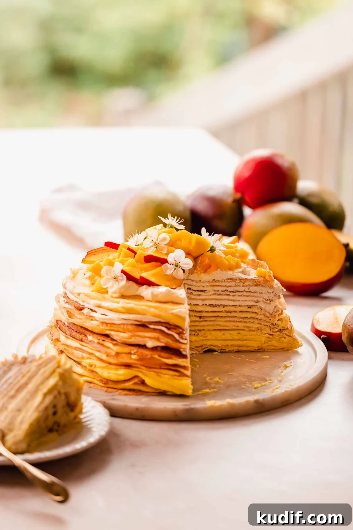Mango Crepe Cake Recipe with Homemade Crepes Made from Scratch 2 mango crepe cake with a cut slice