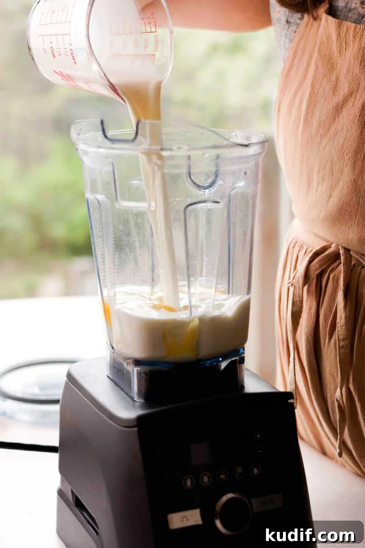 Mango Crepe Cake Recipe with Homemade Crepes Made from Scratch 5 pouring crepe ingredients into a blender