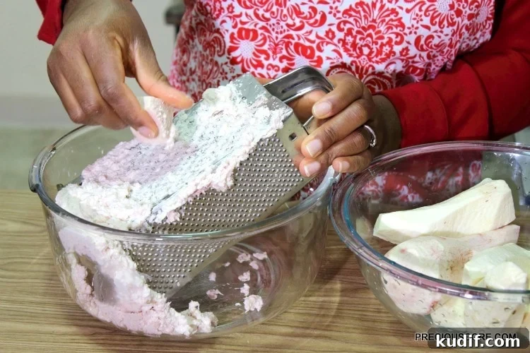How to Make Authentic Ekwang: Step-by-Step Cameroonian Recipe 8 Grating ekwang on a box grater.