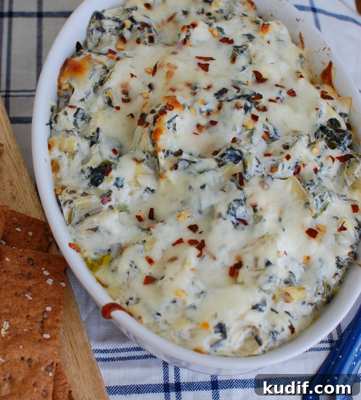 Lemony Spinach and Artichoke Dip Recipe for Parties 4 Lemon Spinach Artichoke Dip in white bowl