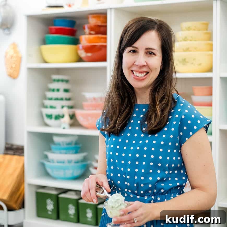 Strawberry Graham Poke Cake Recipe with Creamy Filling 3 woman scooping pistachio salad into a parfait dish, with colorful vintage bowls in the background.