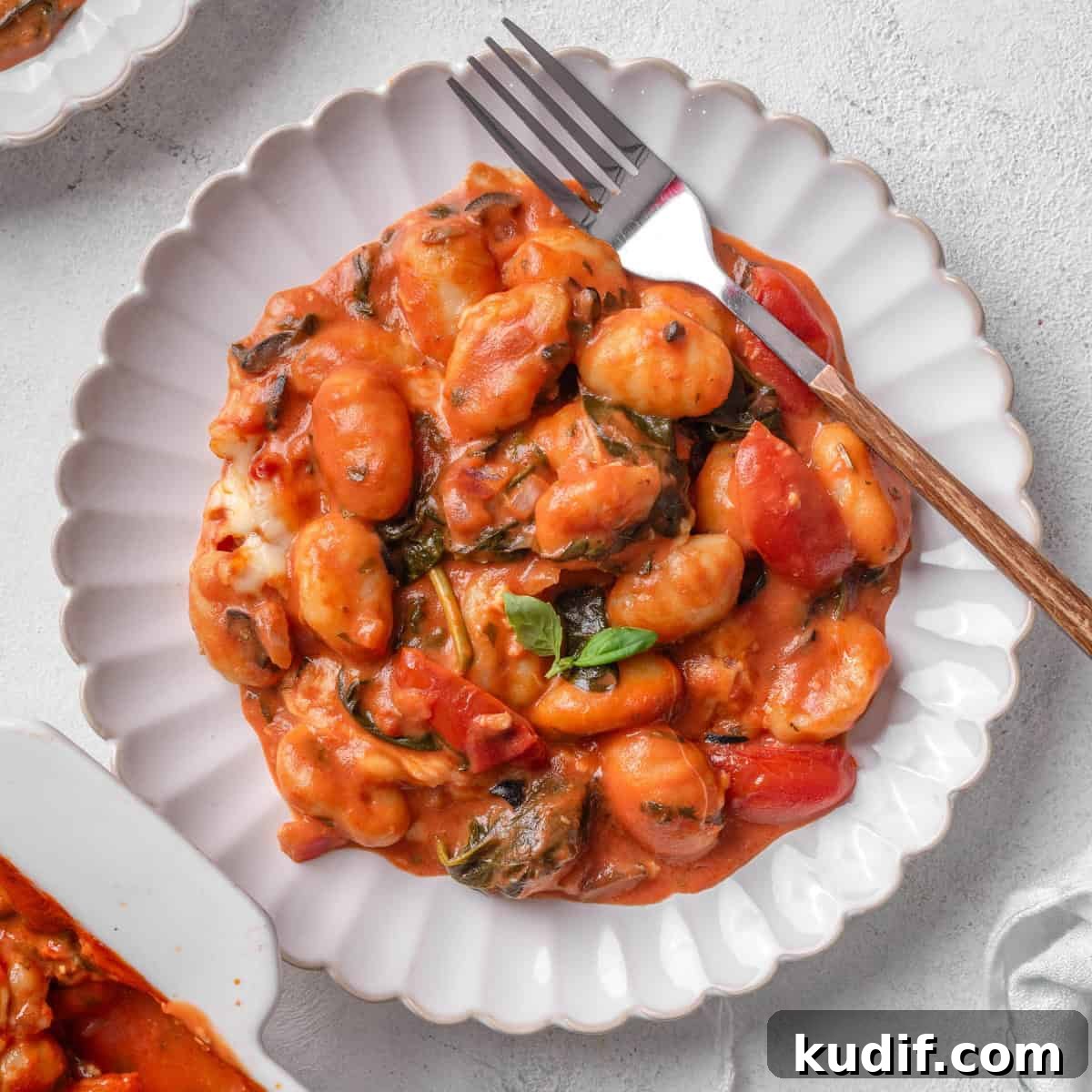 Baked gnocchi served on a plate.