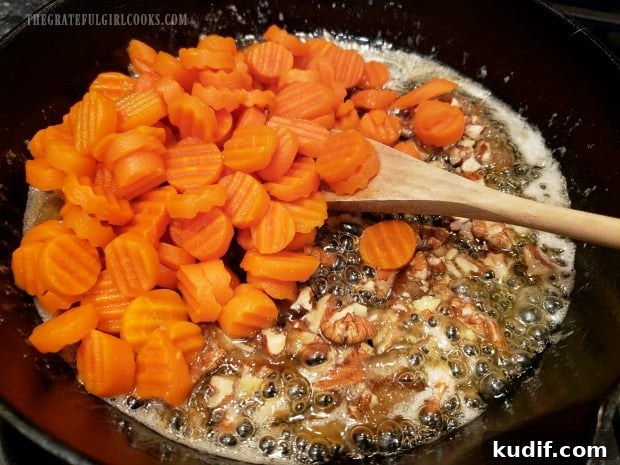 Orange Glazed Carrots - The Grateful Girl Cooks! The cooked carrots are now added to the orange glaze in skillet.