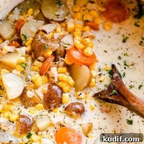 close up shot of chowder with leftover turkey, potatoes, and corn