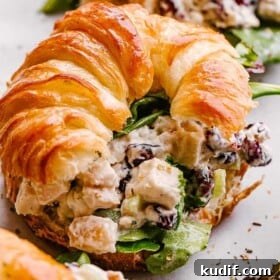 Turkey salad served with a croissant.