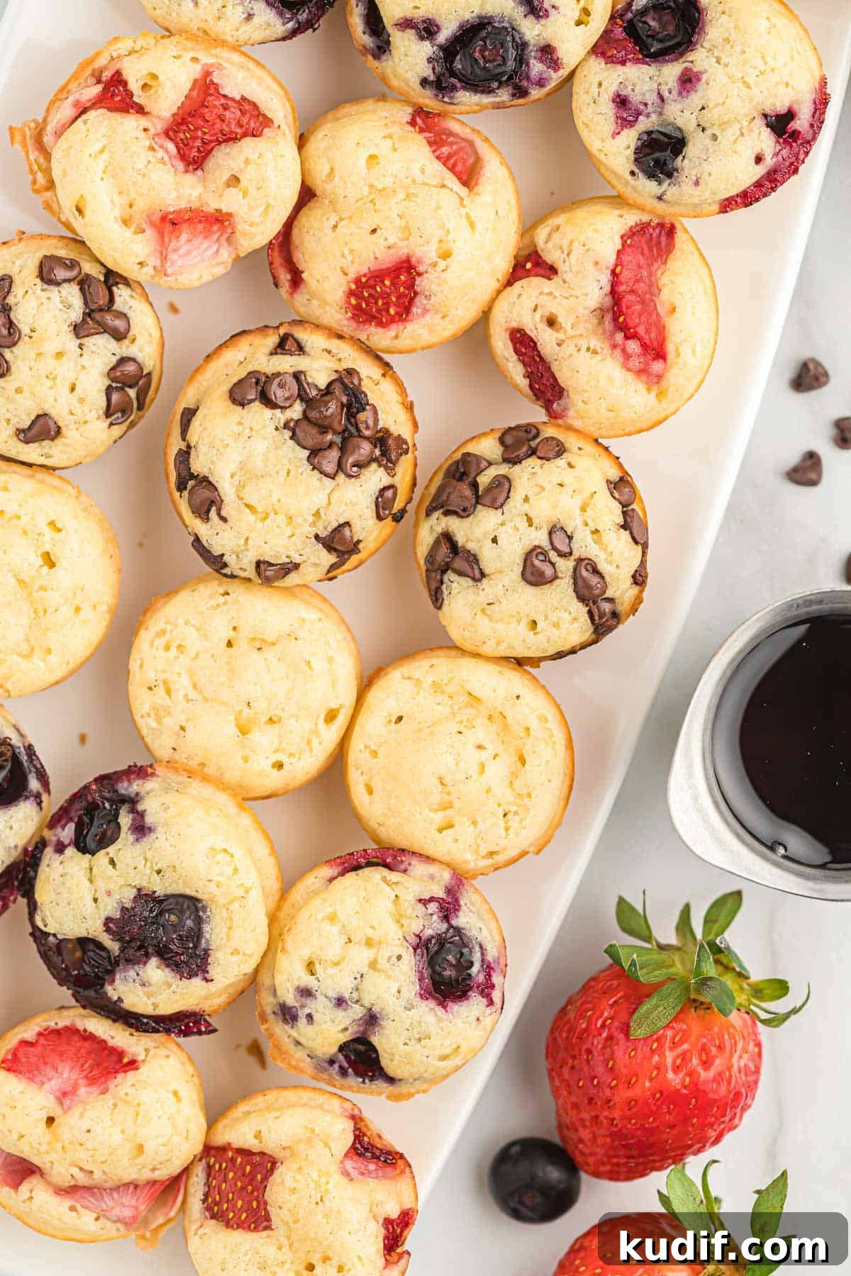 Fluffy Pancake Mini Muffins: Bite-Sized Breakfast Treats 2 mini pancake muffins on a white platter