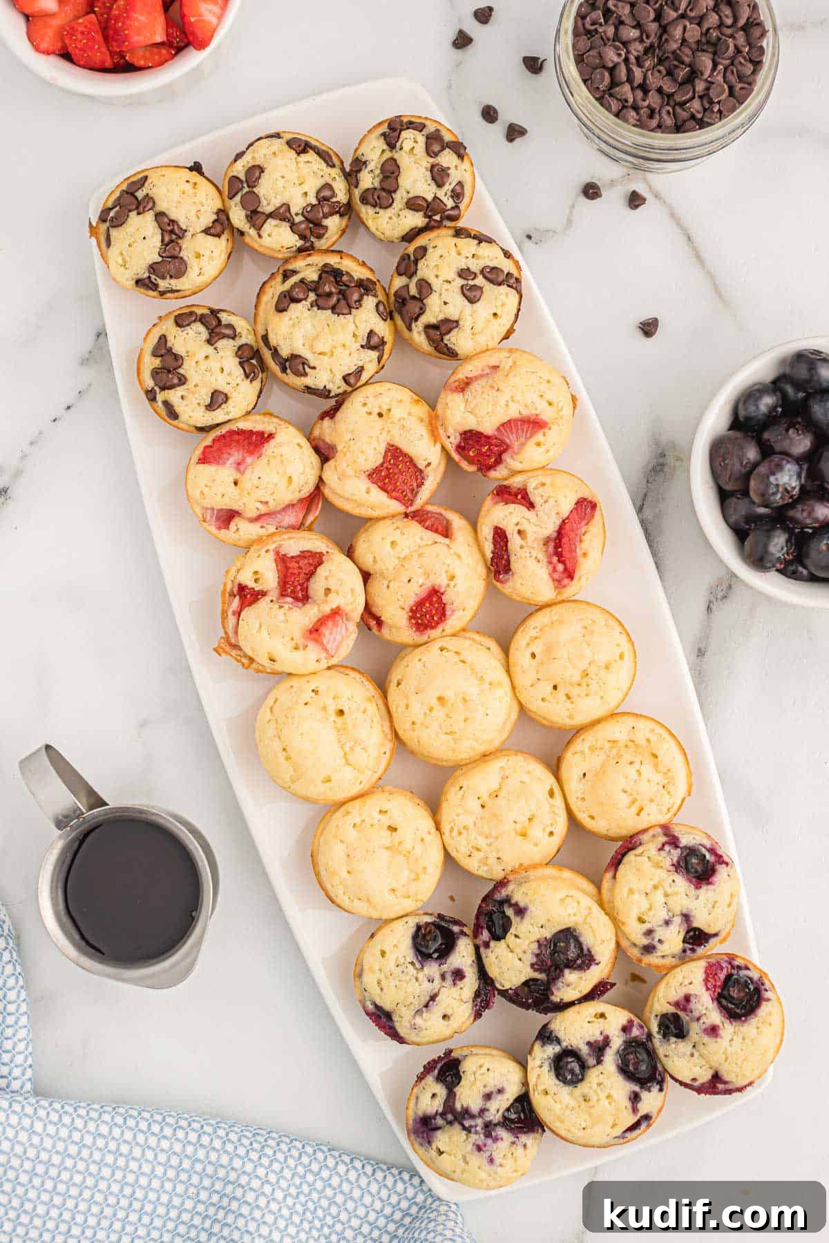 Fluffy Pancake Mini Muffins: Bite-Sized Breakfast Treats 11 mini pancake muffins on a white platter