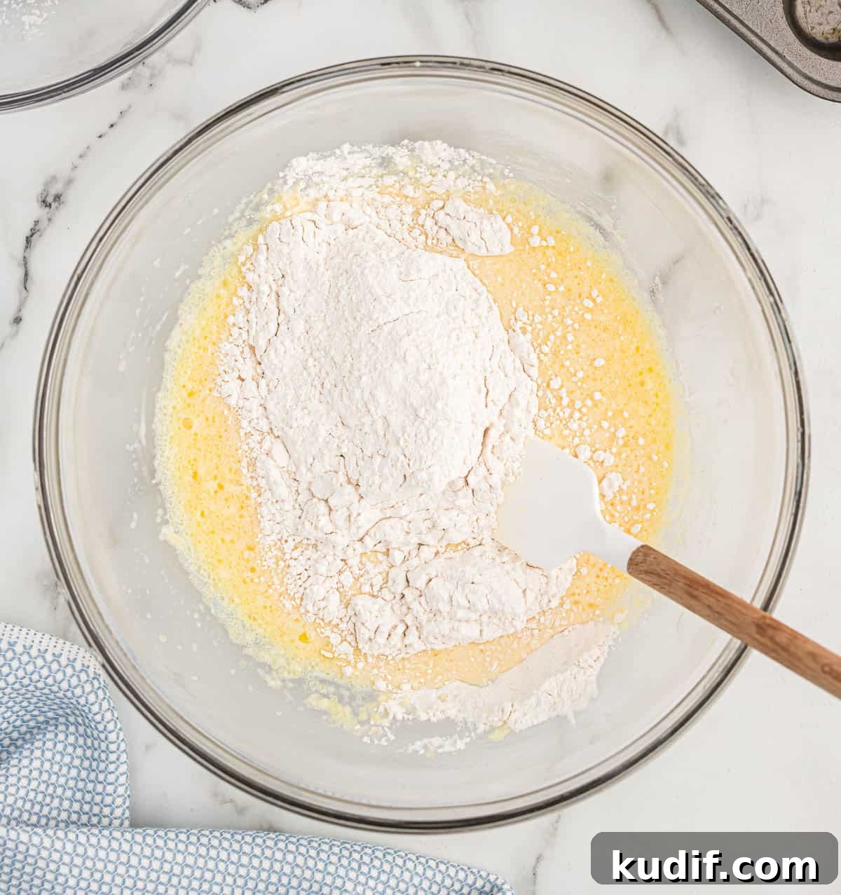 Fluffy Pancake Mini Muffins: Bite-Sized Breakfast Treats 6 adding the dry ingredients to the wet ingredients
