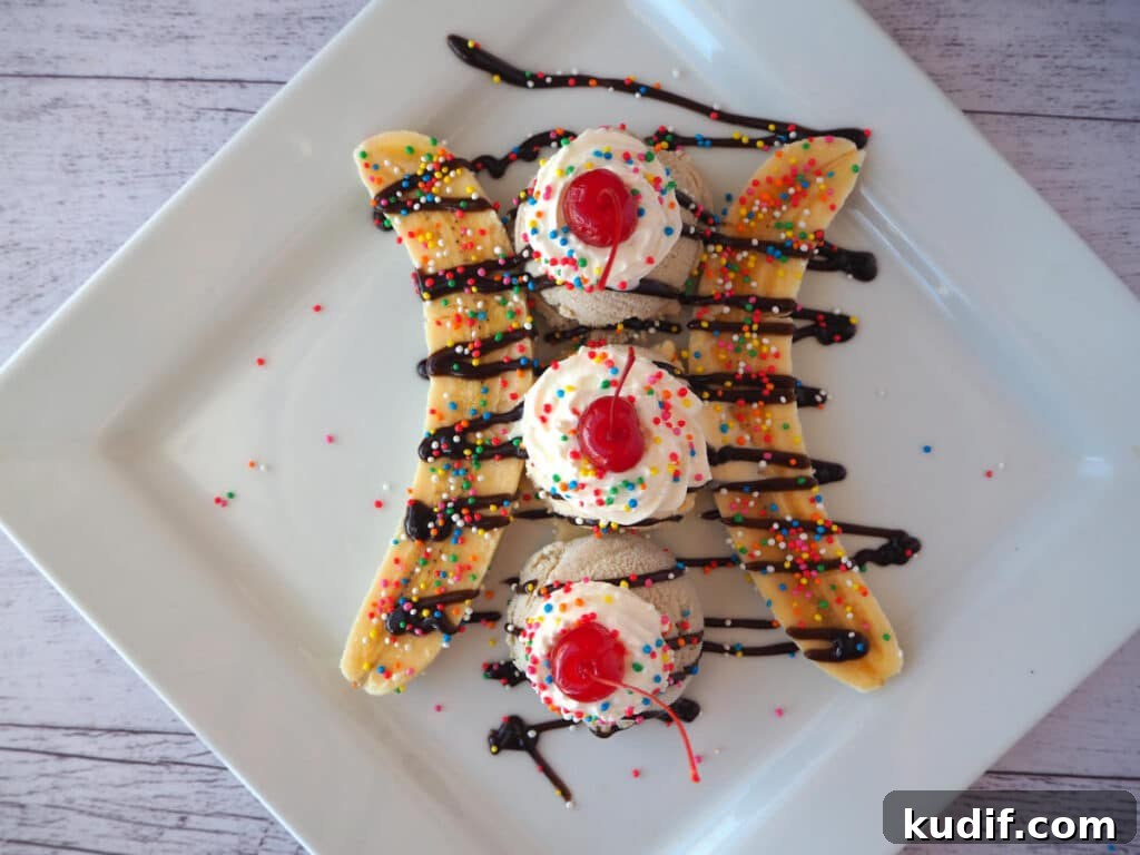 Classic Banana Split Recipe | Step-by-Step Dessert Guide 11 Top down view adding cherries.