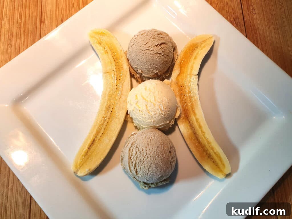 Classic Banana Split Recipe | Step-by-Step Dessert Guide 7 Adding banana and vanilla ice cream to plate between split banana pieces.