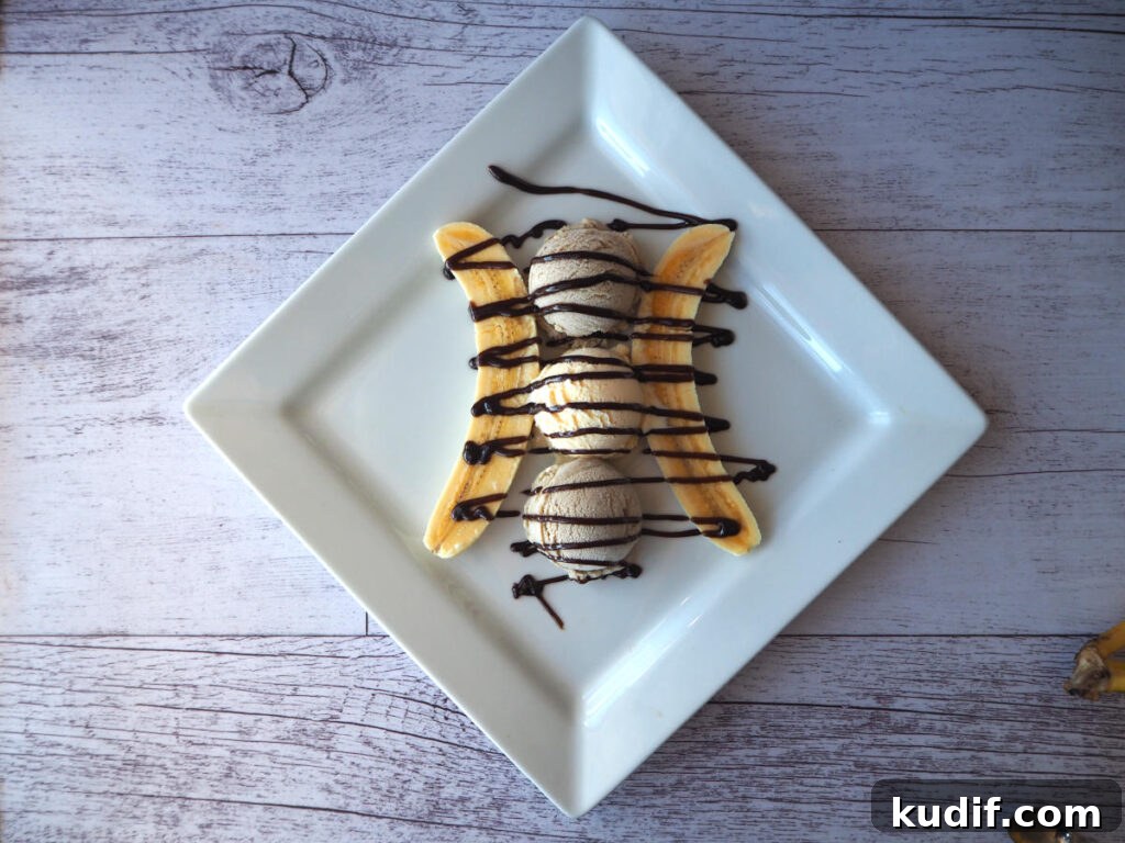 Classic Banana Split Recipe | Step-by-Step Dessert Guide 8 Top down view adding chocolate sauce.