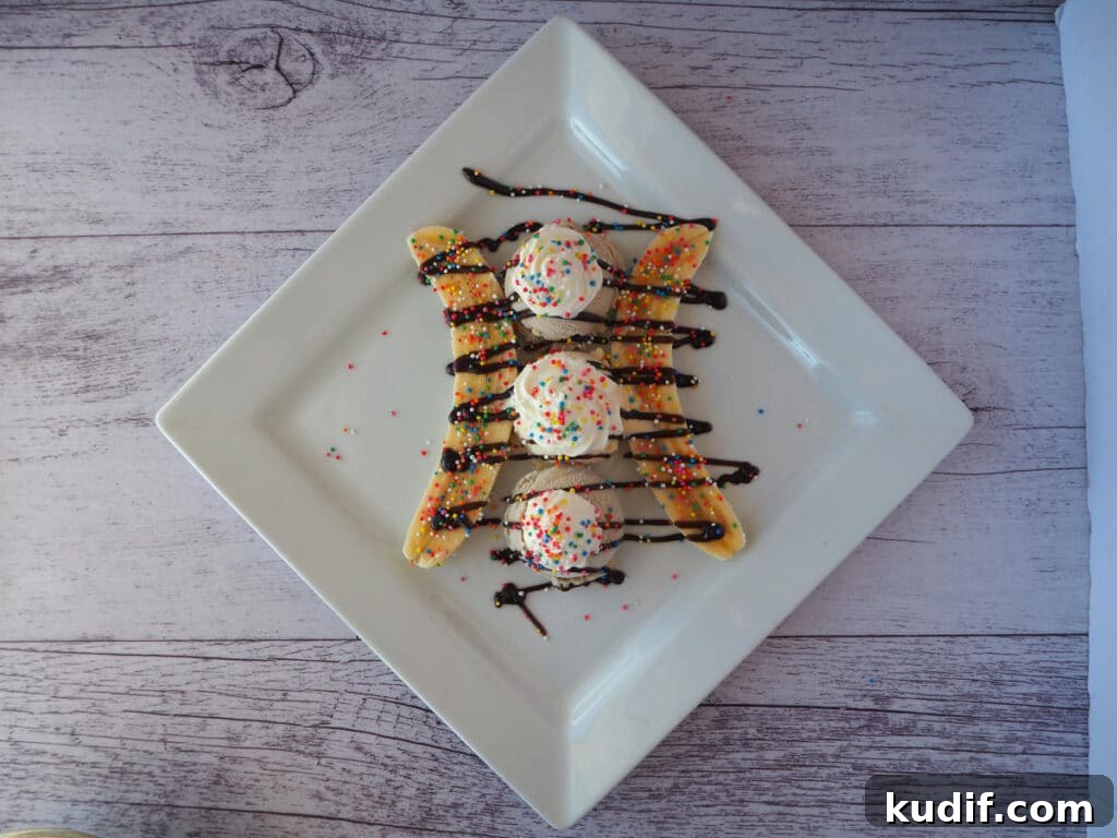 Classic Banana Split Recipe | Step-by-Step Dessert Guide 10 Top down view adding sprinkles.