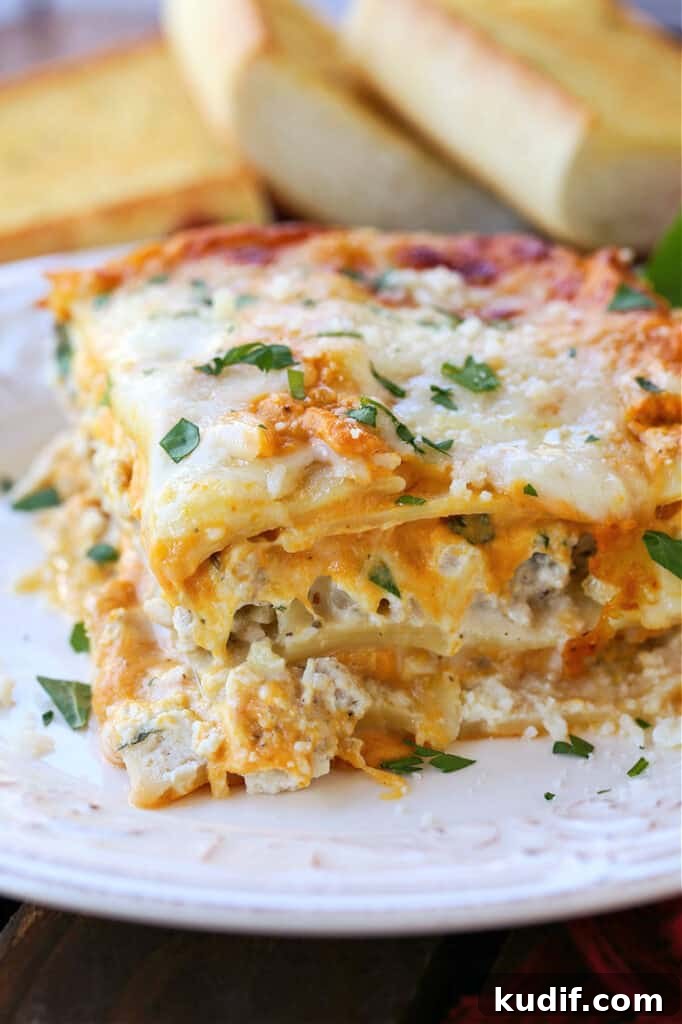 Slice of turkey lasagna on a white plate