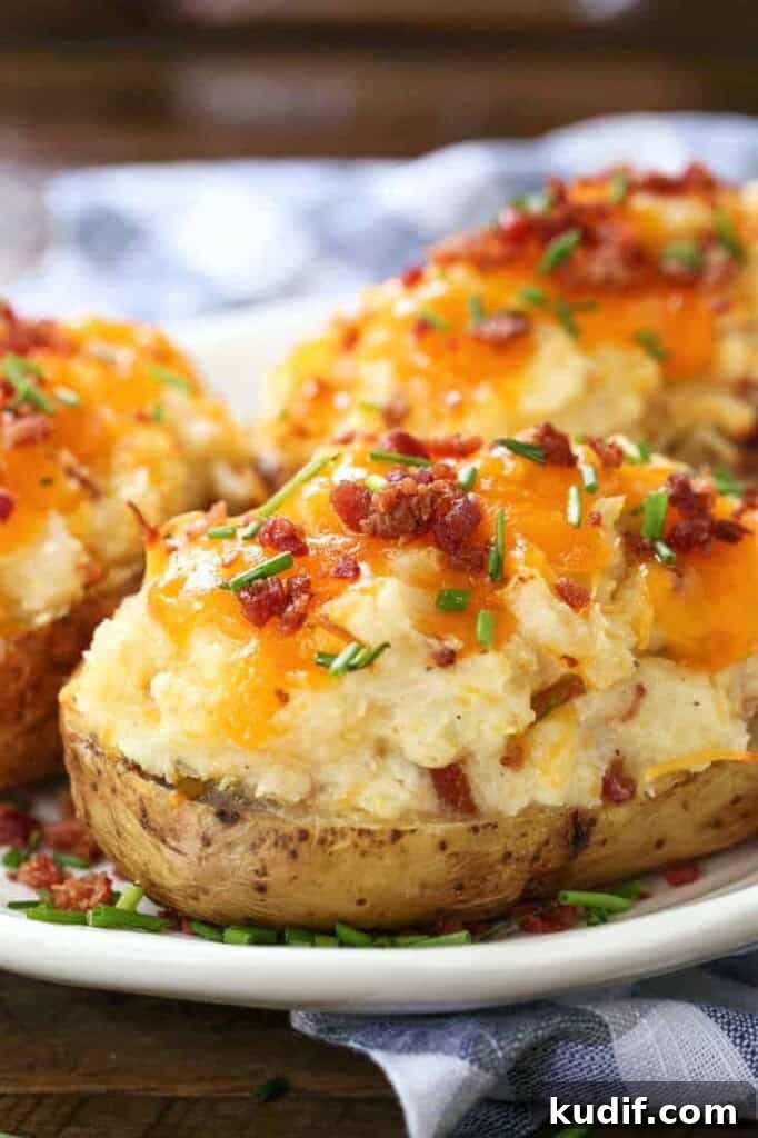 Twice Baked potatoes on a plate with checkered napkin