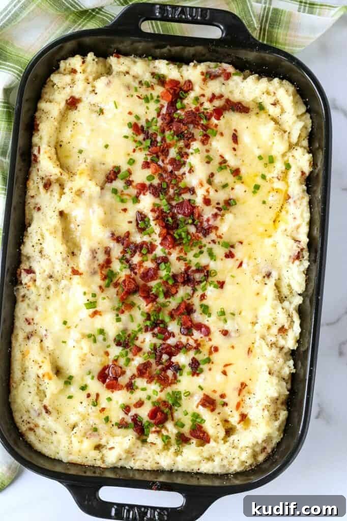twice baked potato casserole topped with bacon and chives