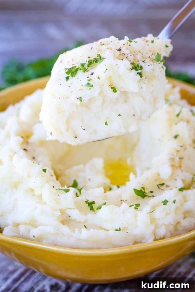 Perfectly Smooth Mashed Potatoes are the fluffiest mashed potato recipe ever!